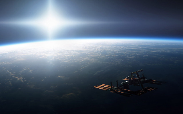 Space station earth sunbeam ocean free wallpaper - medium preview image
