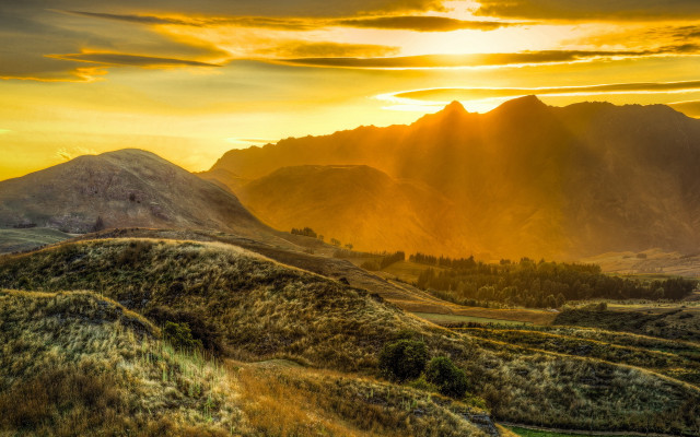Mountain range sunset clouds grassy #2 free wallpaper - medium preview image