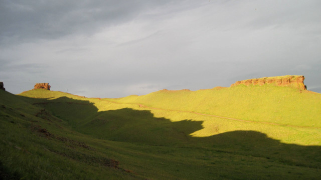 Grassy hill cloudy sky landscape free wallpaper - medium preview image