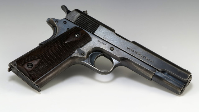 Gun white surface black handle free wallpaper - medium preview image