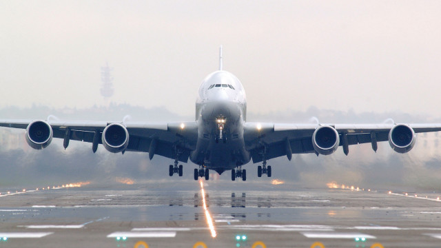 Jetliner takeoff fog night tiltshift free wallpaper - medium preview image