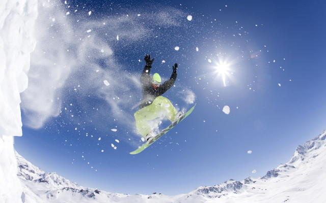 Snowboarder midair sunny winter night free wallpaper - medium preview image