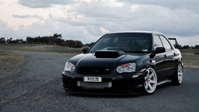 Black car gravel road field #2 free wallpaper - medium preview image
