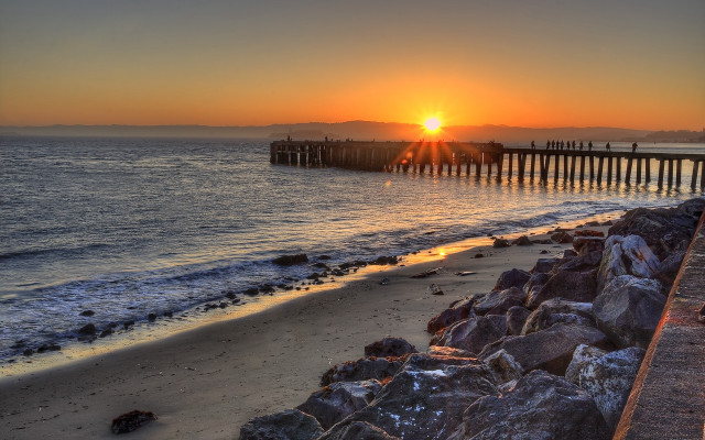 Sunset beach pier rocks ocean free wallpaper - medium preview image