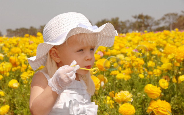 Little girl blowing bubbles yellow free wallpaper - medium preview image