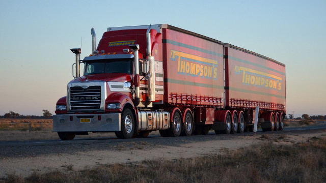 Semi truck desert sunset trailer free wallpaper - medium preview image