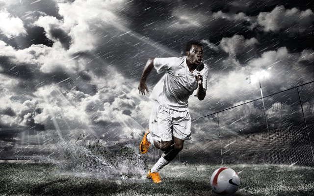 Man kicking soccer rain cloudy free wallpaper - medium preview image