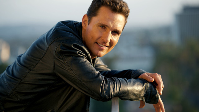 Man black jacket hologram promotional free wallpaper - medium preview image