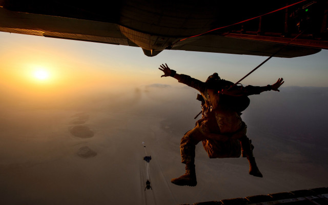 Man suspended plane sunset precisionism free wallpaper - medium preview image