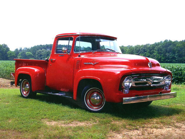 Red truck parked field grass free wallpaper - medium preview image