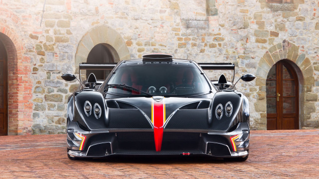 Black sports car stone building free wallpaper - medium preview image