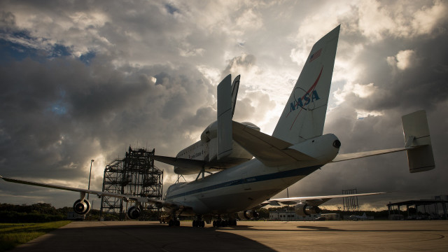 Large airplane tarmac cloudy sky free wallpaper - medium preview image