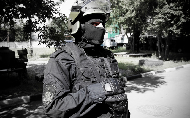 Man black jacket helmet gun free wallpaper - medium preview image