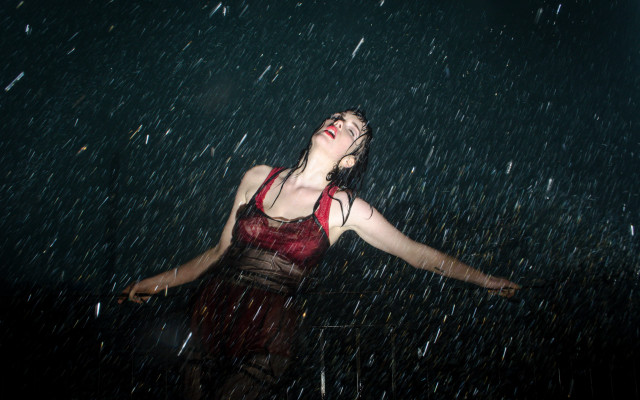 Woman red top rain arms free wallpaper - medium preview image
