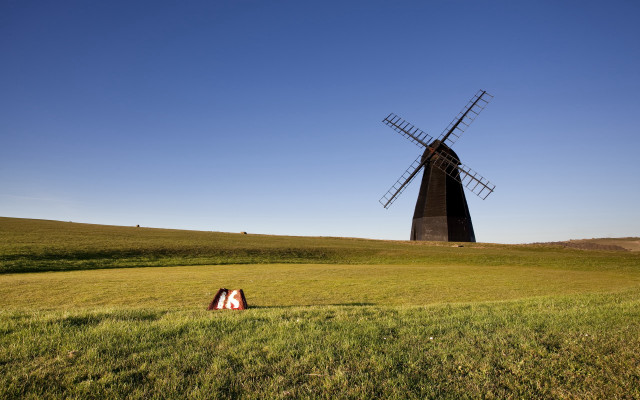Windmill field person tiltshift sunset #2 free wallpaper - medium preview image