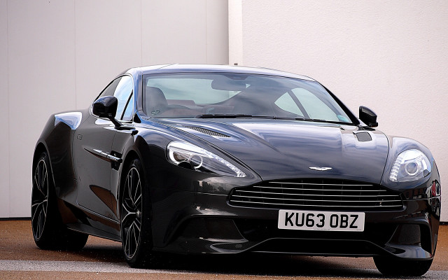 Black sports car white building free wallpaper - medium preview image
