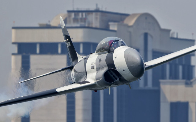 Fighter jet smoke building motion free wallpaper - medium preview image