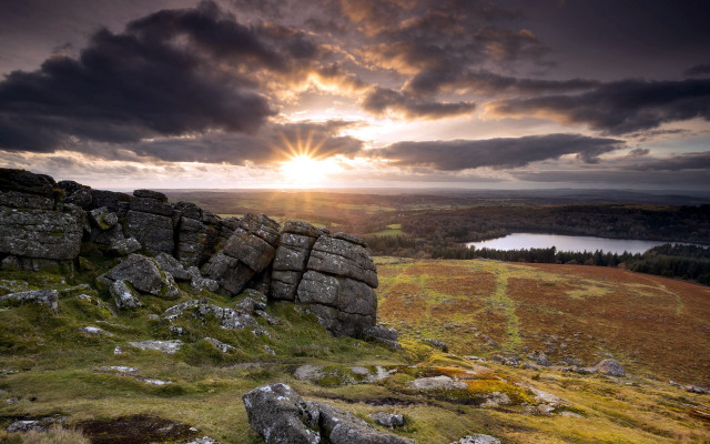 Rocky outcrop lake cloudy sky free wallpaper - medium preview image