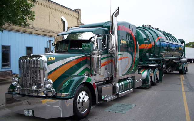 Green orange truck driving street free wallpaper - medium preview image