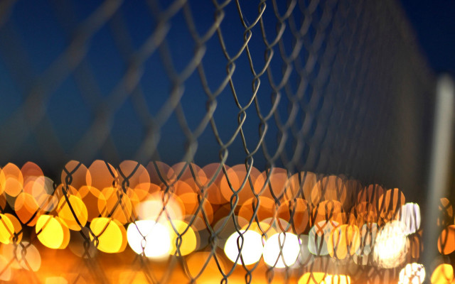 Blurry fence lights autumn leaves free wallpaper - medium preview image