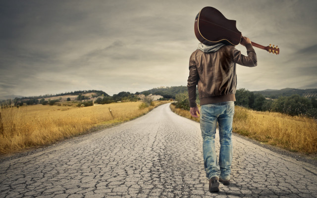 Man walking guitar hat beach free wallpaper - medium preview image