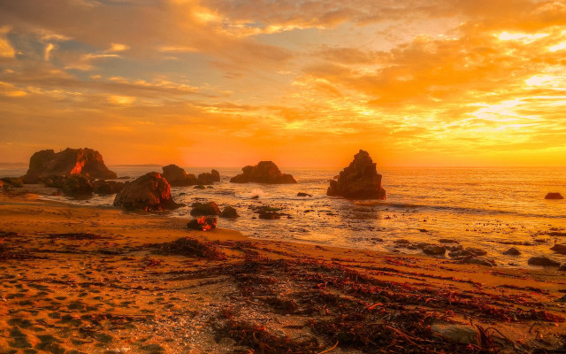 Sunset beach rocks water people free wallpaper - medium preview image