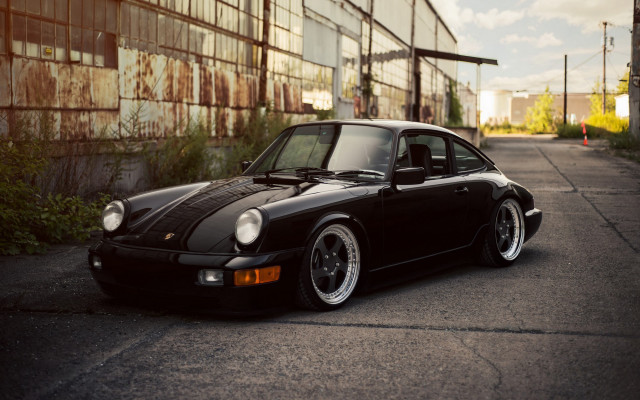 Black porsche building bushes sunset free wallpaper - medium preview image