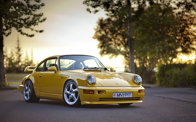 Yellow porsche sunset forest backlit free wallpaper - medium preview image
