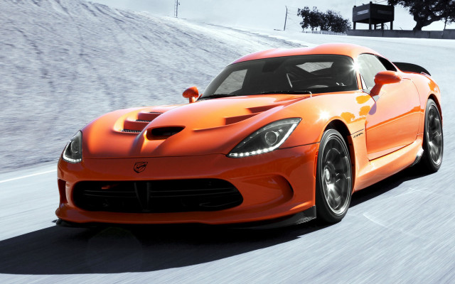 Bright orange sports car snowy free wallpaper - medium preview image