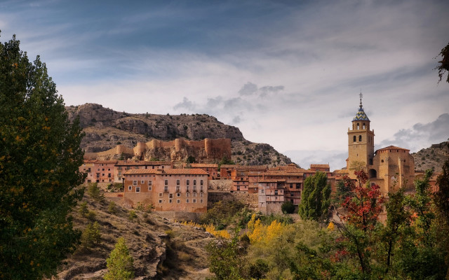 Village clocktower hillside mountains architecture free wallpaper - medium preview image