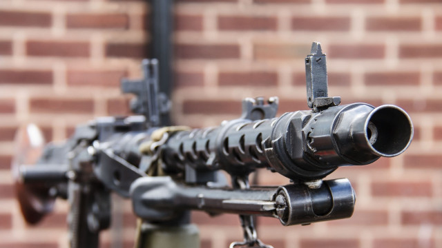 Machine gun brick wall precisionism free wallpaper - medium preview image