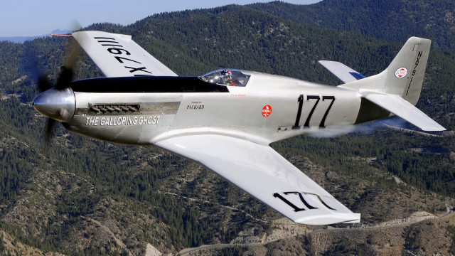 Small airplane mountain trees clouds free wallpaper - medium preview image