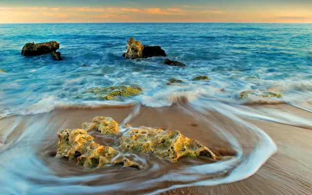 Beach waves rocks sand sky free wallpaper - medium preview image