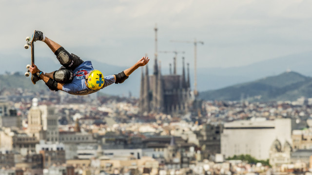 Skateboarder cityscape cathedral hyperrealistic motionblur free wallpaper - medium preview image