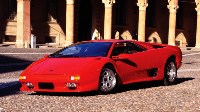 Red sports car building columns free wallpaper - medium preview image