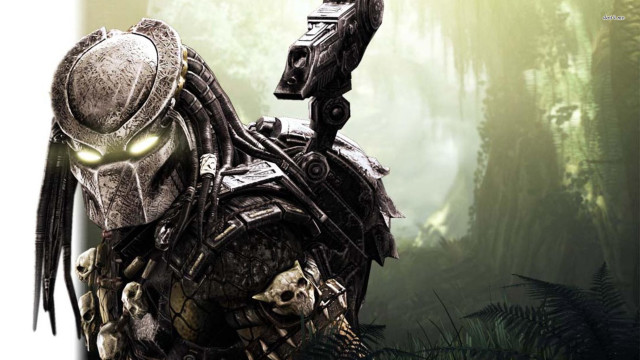 Predator with gun in forest free wallpaper - medium preview image