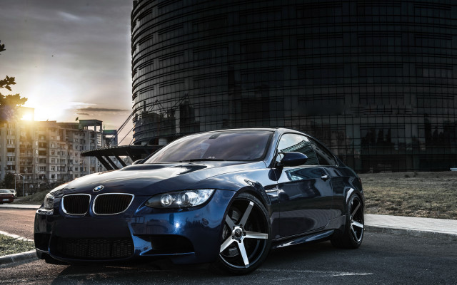 Blue car tall building sunset free wallpaper - medium preview image