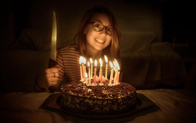 Woman holding knife cake lit free wallpaper - medium preview image