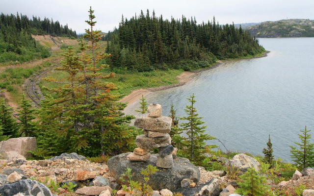 Pile of rocks lush hillside free wallpaper - medium preview image