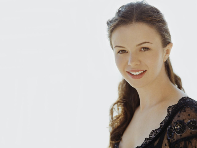 Smiling woman black dress white free wallpaper - medium preview image