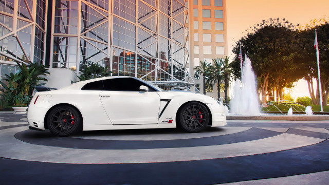 White sports car fountain sunset free wallpaper - medium preview image