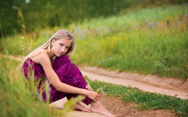 Young girl sitting dirt road free wallpaper - medium preview image