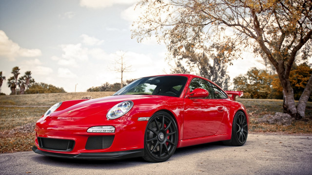 Red sports car autumn leaves #2 free wallpaper - medium preview image