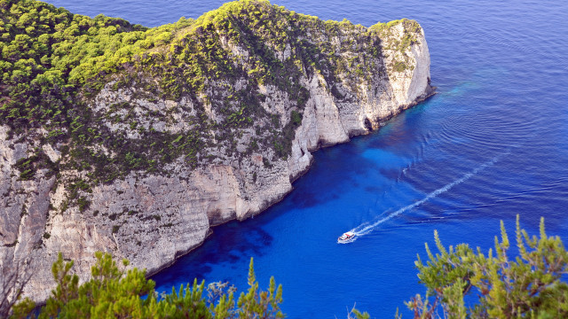 Boat cliff water blue ocean free wallpaper - medium preview image