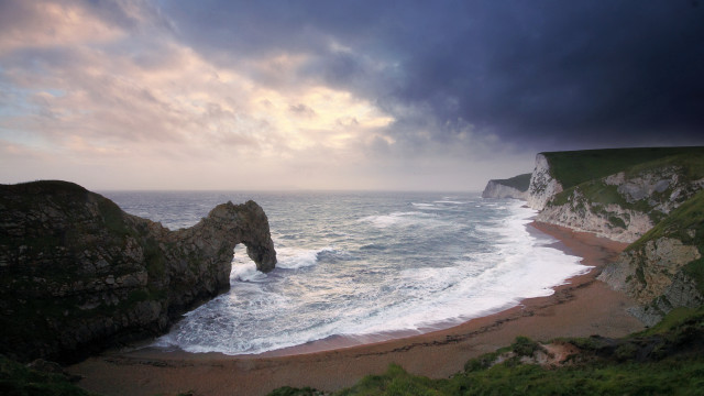 Beach rock formation stormy sky free wallpaper - medium preview image