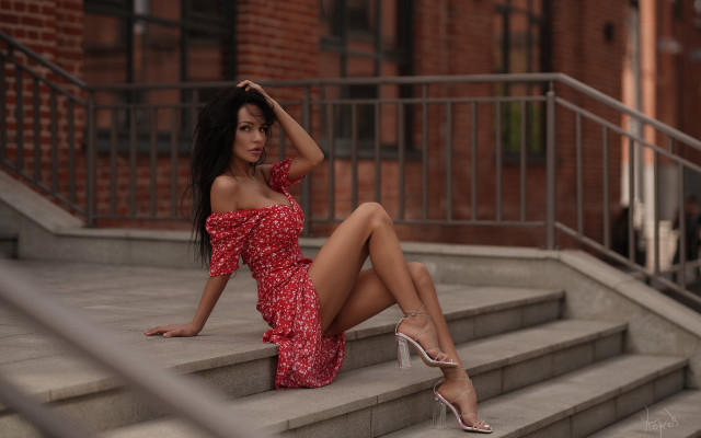 Red dress sitting steps blurry free wallpaper - medium preview image