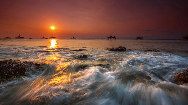 Sunset water ships rocks shoreline free wallpaper - medium preview image