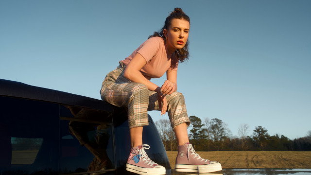 Woman sitting car shoes plaid free wallpaper - medium preview image