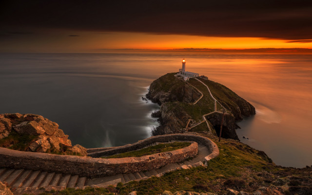 Lighthouse cliff stairway sunset cloudy free wallpaper - medium preview image