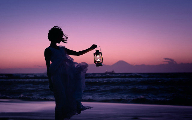 Woman lantern beach sunset mountain free wallpaper - medium preview image